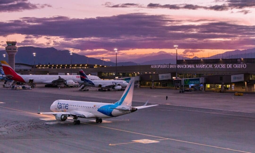 A plane taxis into Quito's Award-winning International Airport at sunset.